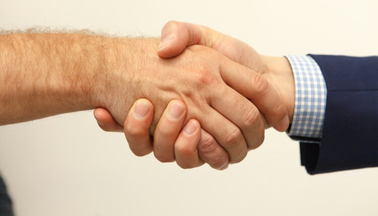 man and woman holding hands