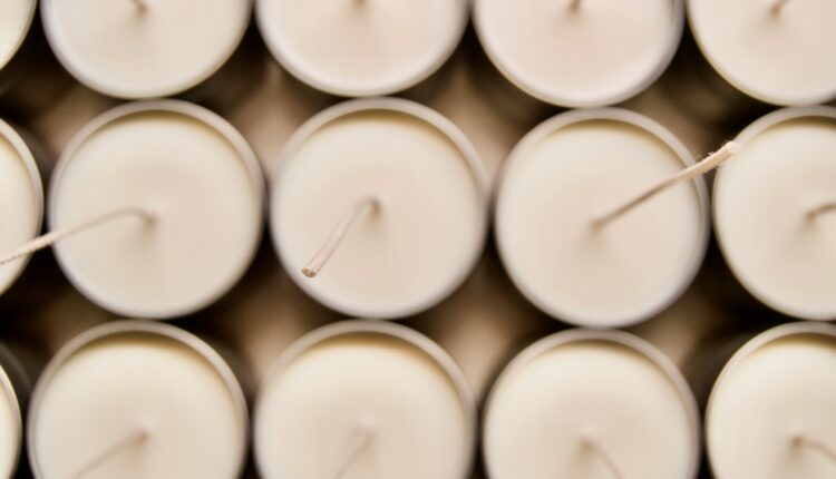 white candles on black surface